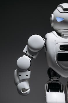 Close-up of a sleek and futuristic robot arm, highlighting advanced robotics design.