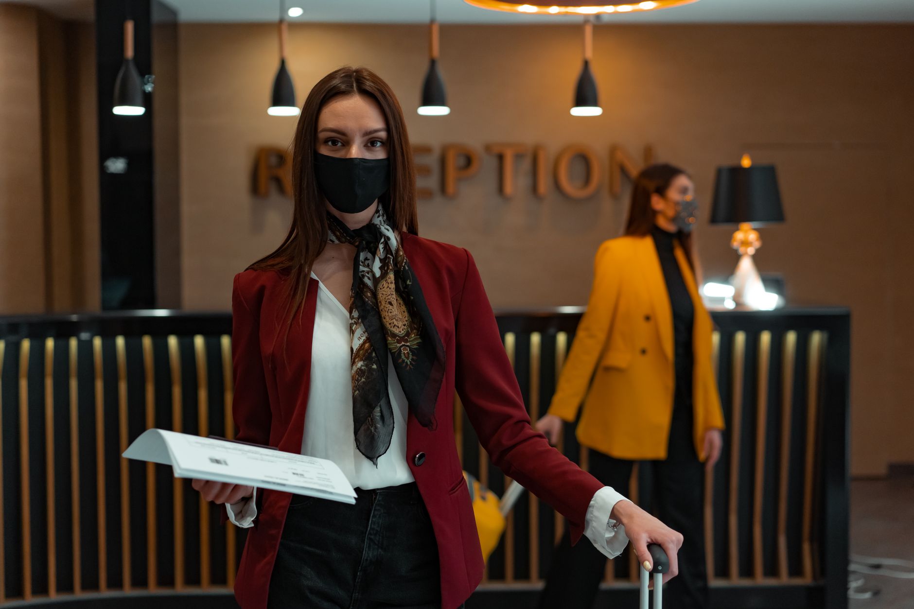 Hotel Check-In Time & Upgrades: What Strategy Maximizes Your Odds? - hotel front desk check-in guest, hotel suite room upgrade interior, traveler waiting hotel lobby luggage