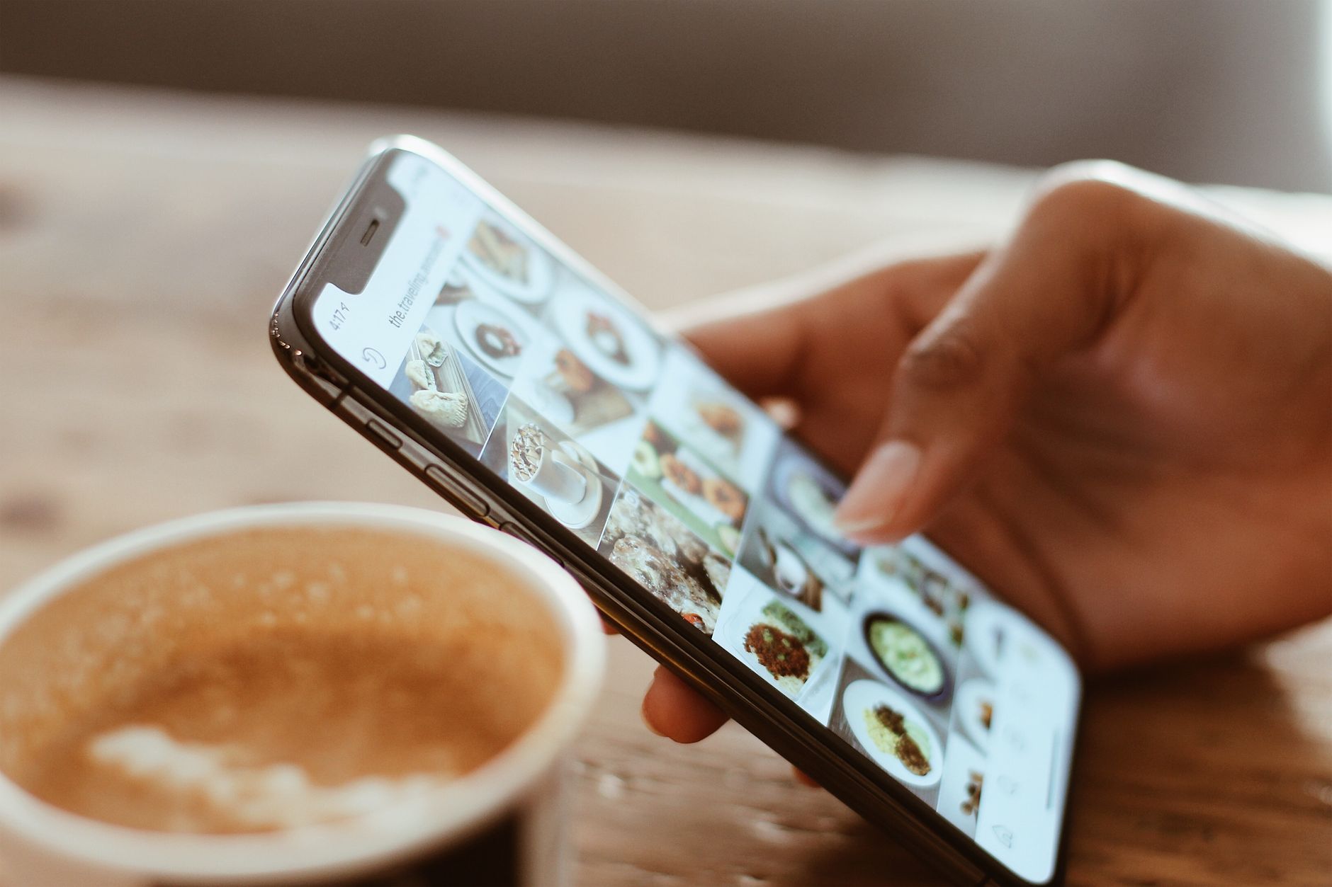 인스타 최신순, 조회수순 정렬해결법 - close up hand scrolling instagram feed on phone