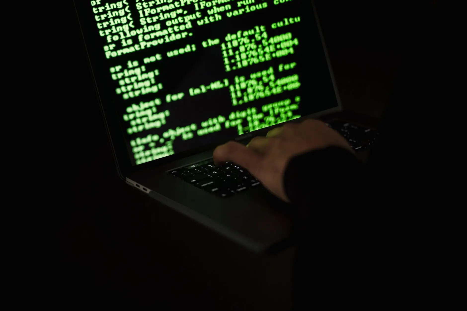 또다시 해커된 GPT - hacker silhouette typing on laptop with code on screen